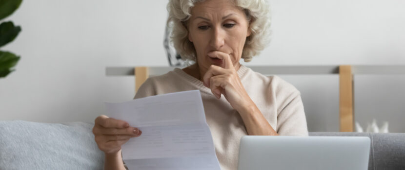 A woman looking at some paperwork.