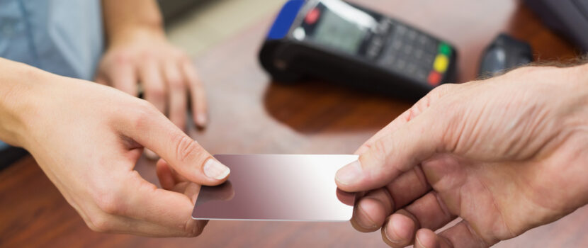 A cashier taking payment from a customer.