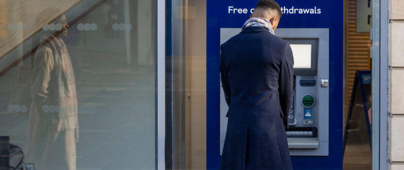 A man withdrawing money from an ATM.