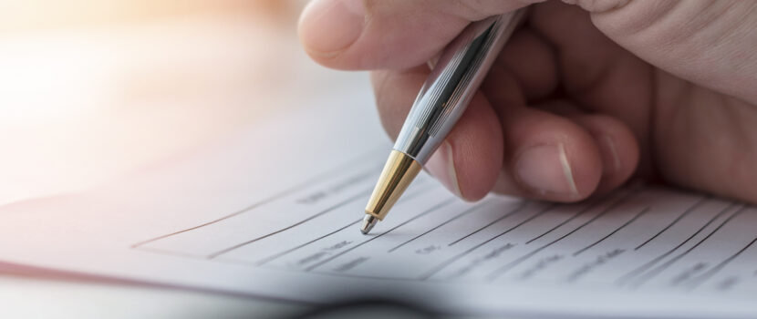 A person filling in paperwork.